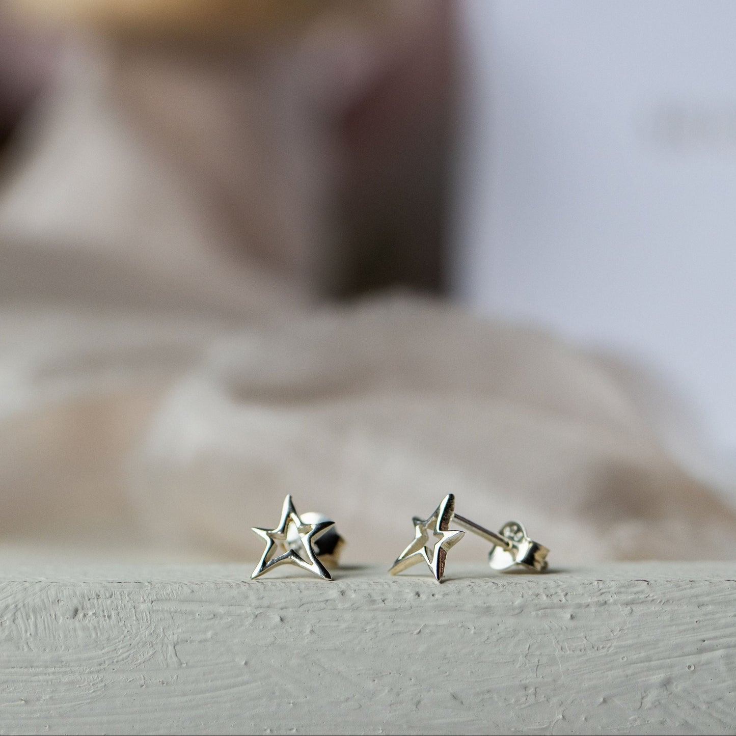 Vela Hollow Star Stud Earrings